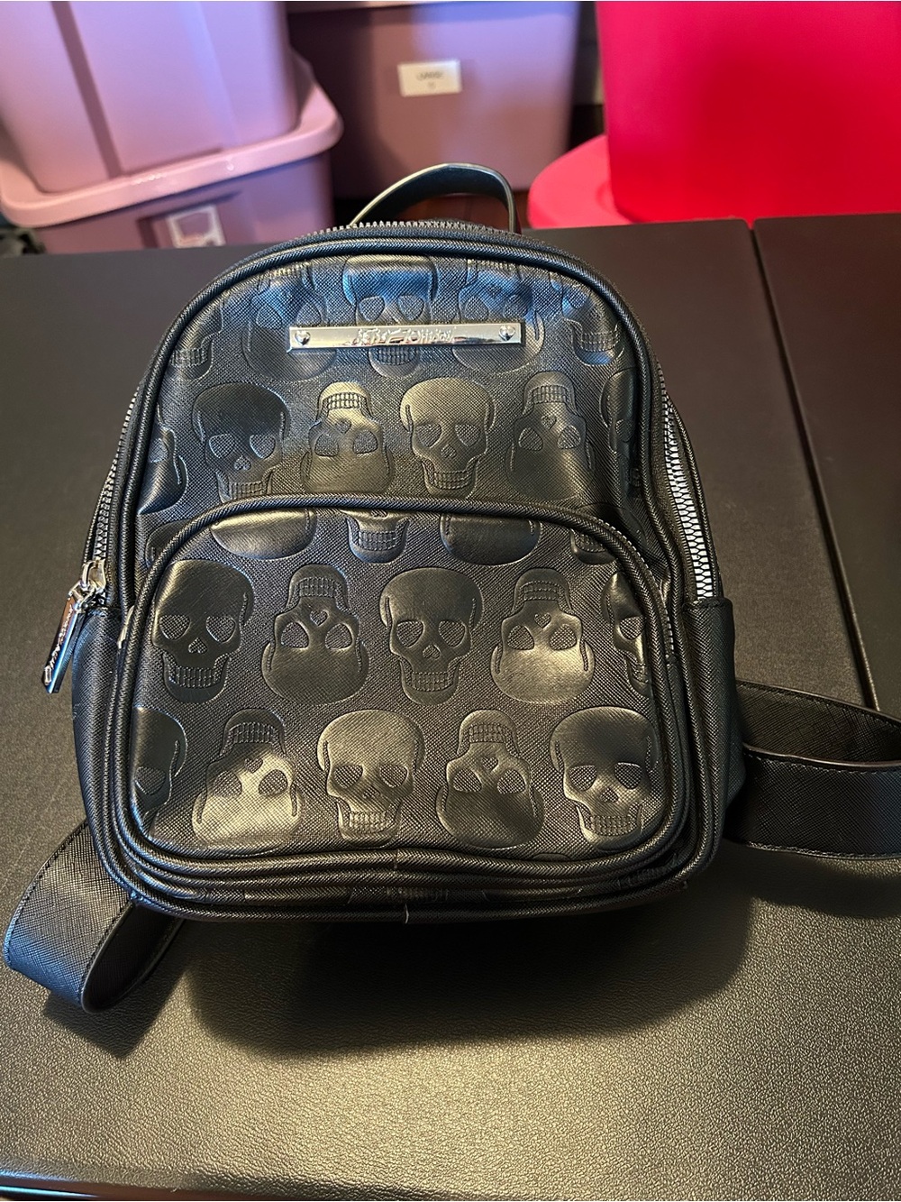 Betsey Johnson Black Skull-Embossed Mini Backpack